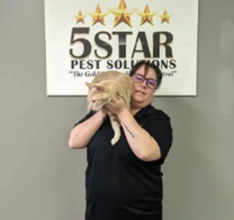 5-Star Pest Control employee holding a cat